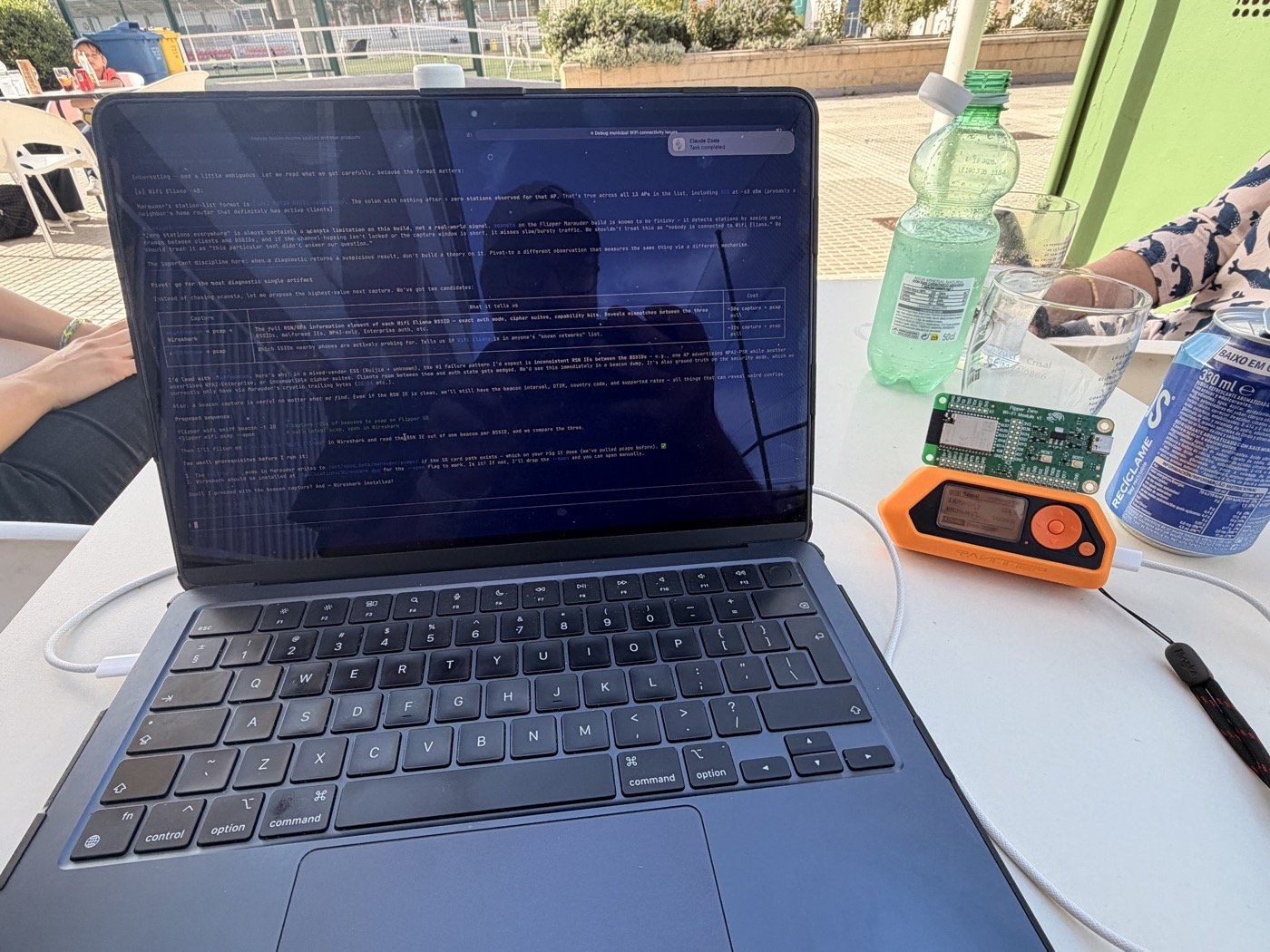 Flipper Zero and laptop at the pool — scanning municipal WiFi